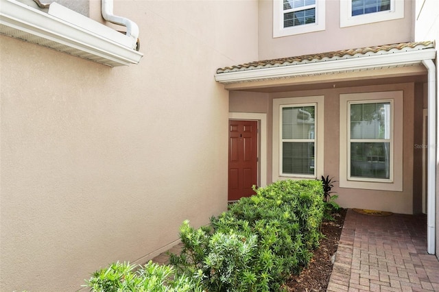 1225 Bella Cara Ct Unit 1, Davenport, FL 33896 - doorway to property with stucco siding