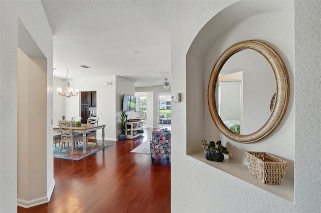1225 Bella Cara Ct Unit 1, Davenport, FL 33896 - corridor with wood finished floors and a chandelier