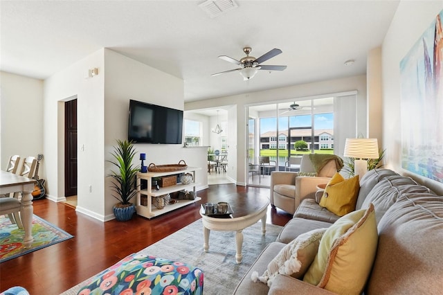 1225 Bella Cara Ct Unit 1, Davenport, FL 33896 - living room featuring ceiling fan, wood finished floors, and baseboards
