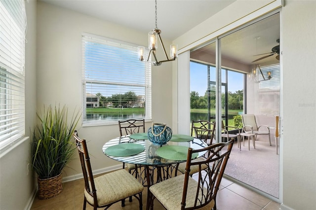 1225 Bella Cara Ct Unit 1, Davenport, FL 33896 - dining room featuring healthy amount of natural light, ceiling fan, and a water view