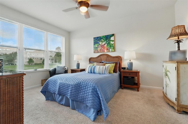 1225 Bella Cara Ct Unit 1, Davenport, FL 33896 - bedroom with light carpet, baseboards, and a ceiling fan