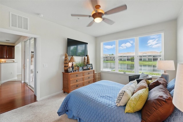 1225 Bella Cara Ct Unit 1, Davenport, FL 33896 - bedroom with light carpet, a ceiling fan, and baseboards