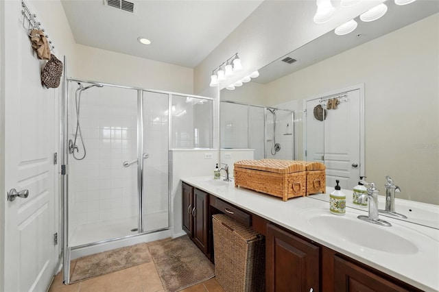 1225 Bella Cara Ct Unit 1, Davenport, FL 33896 - bathroom with a stall shower, double vanity, and tile patterned flooring