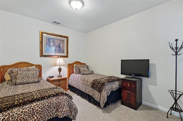 1225 Bella Cara Ct Unit 1, Davenport, FL 33896 - bedroom with light carpet and baseboards