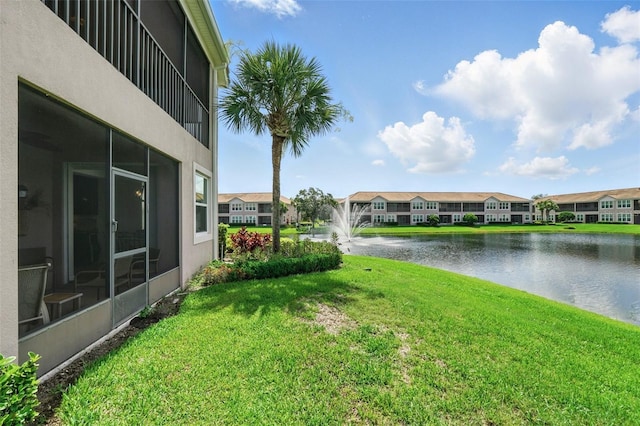 1225 Bella Cara Ct Unit 1, Davenport, FL 33896 - view of grassy yard featuring a water view and a residential view
