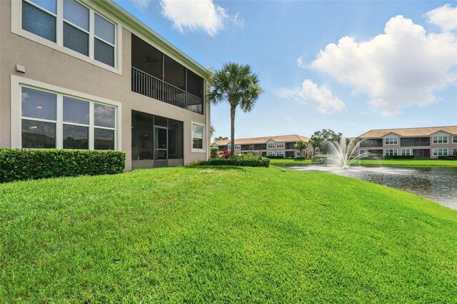 1225 Bella Cara Ct Unit 1, Davenport, FL 33896 - view of green lawn featuring a water view