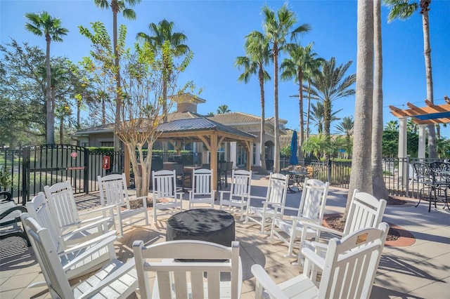 1225 Bella Cara Ct Unit 1, Davenport, FL 33896 - view of patio / terrace featuring a gazebo and a fire pit