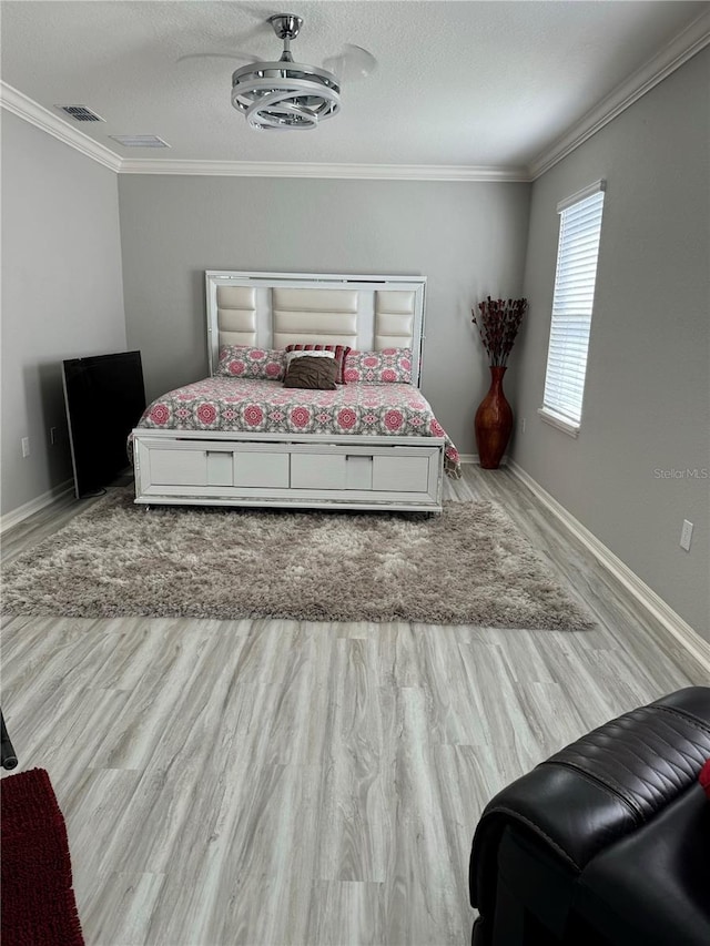 1016 Cascade Dr, Davenport, FL 33837 - bedroom featuring ornamental molding and wood finished floors