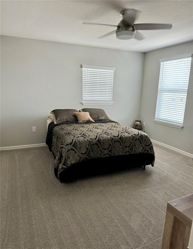 1016 Cascade Dr, Davenport, FL 33837 - bedroom with carpet flooring, ceiling fan, and a textured ceiling