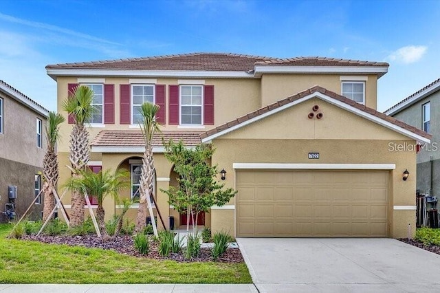 7622 Oakmoss Loop, Davenport, FL 33837 - view of front of property with stucco siding and a tiled roof