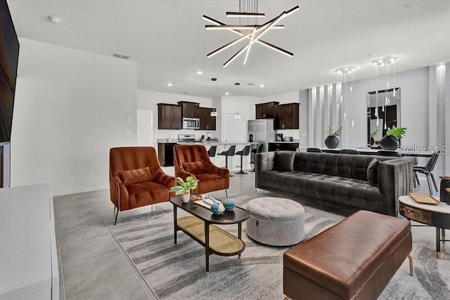 7622 Oakmoss Loop, Davenport, FL 33837 - living room featuring recessed lighting, a chandelier, and baseboards