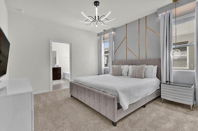 7622 Oakmoss Loop, Davenport, FL 33837 - bedroom with a chandelier, light colored carpet, and ensuite bathroom