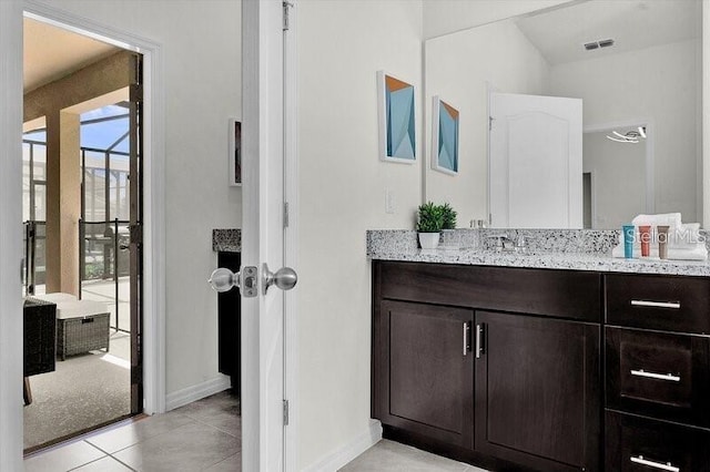 7622 Oakmoss Loop, Davenport, FL 33837 - bathroom featuring baseboards, vanity, and tile patterned flooring