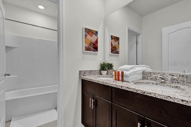 7622 Oakmoss Loop, Davenport, FL 33837 - bathroom with double vanity and shower / bath combination
