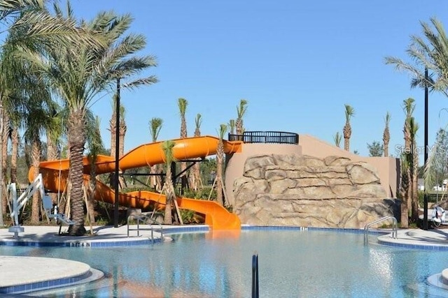 7622 Oakmoss Loop, Davenport, FL 33837 - community pool featuring a water slide
