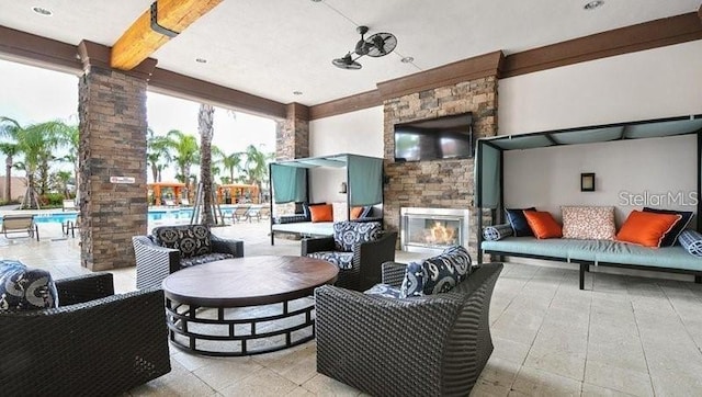 7622 Oakmoss Loop, Davenport, FL 33837 - view of patio / terrace with an outdoor living space with a fireplace and a community pool