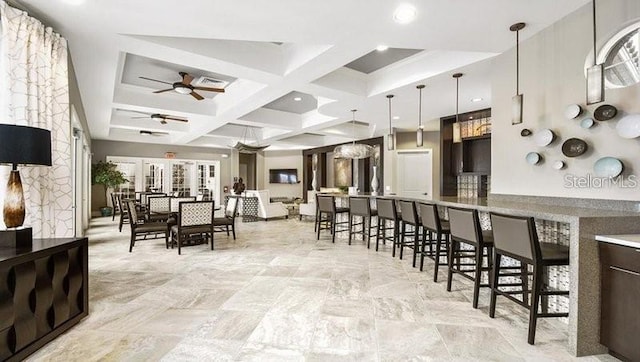 7622 Oakmoss Loop, Davenport, FL 33837 - kitchen featuring coffered ceiling, a ceiling fan, beam ceiling, pendant lighting, and dark brown cabinets