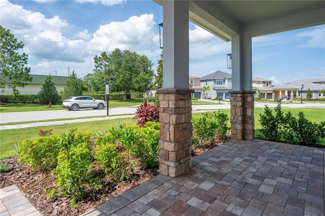 15600 Vetta Dr, Bella Collina, FL 34756 - porch with a yard and a residential view