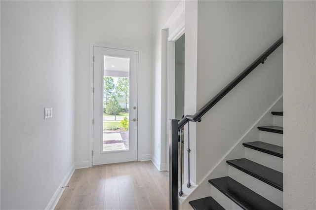 15600 Vetta Dr, Bella Collina, FL 34756 - foyer featuring light wood-style floors and stairway