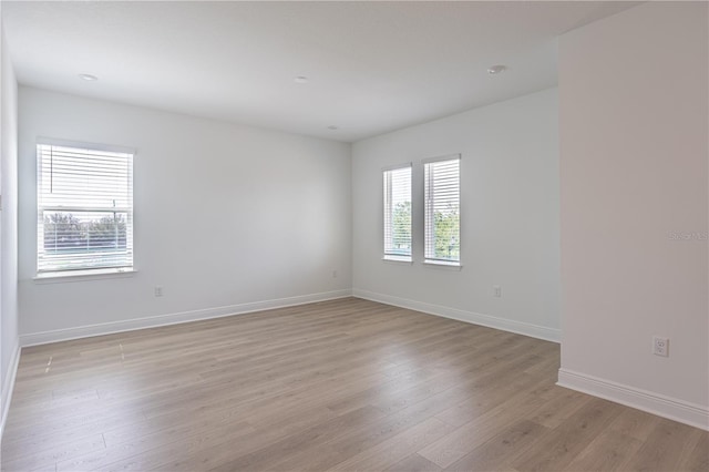 15600 Vetta Dr, Bella Collina, FL 34756 - spare room featuring light wood-style flooring and baseboards