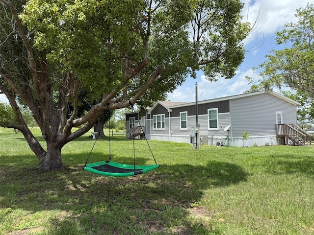 15311 Johns Lake Rd, Clermont, FL 34711 - back of house with a yard