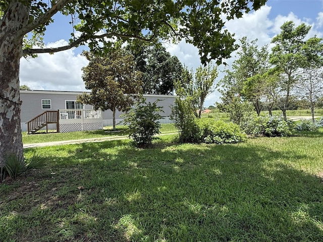 15311 Johns Lake Rd, Clermont, FL 34711 - view of grassy yard with a wooden deck