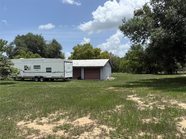 15311 Johns Lake Rd, Clermont, FL 34711 - view of grassy yard featuring a garage and an outdoor structure