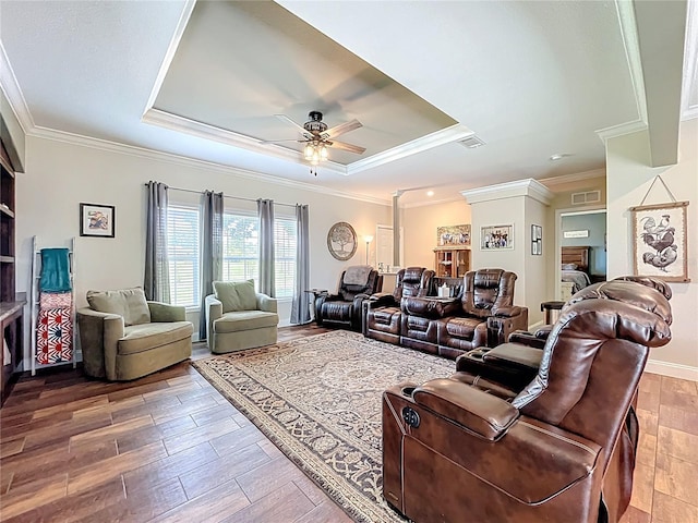 15311 Johns Lake Rd, Clermont, FL 34711 - living area featuring a raised ceiling, a ceiling fan, wood finished floors, and crown molding