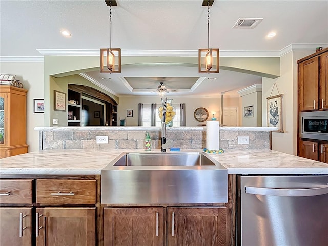 15311 Johns Lake Rd, Clermont, FL 34711 - kitchen featuring appliances with stainless steel finishes, a sink, crown molding, pendant lighting, and ceiling fan