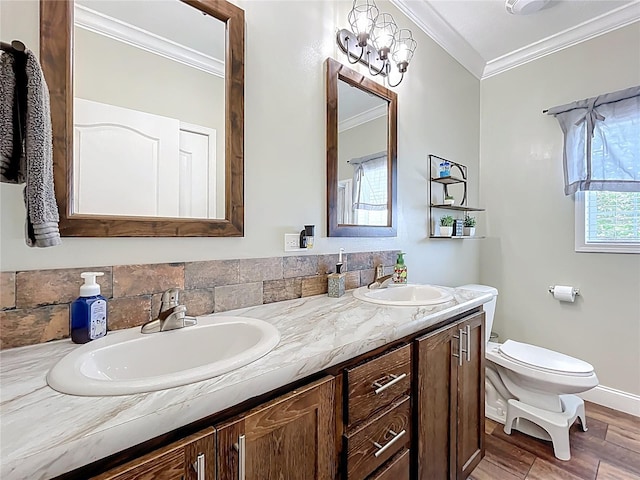15311 Johns Lake Rd, Clermont, FL 34711 - bathroom featuring crown molding, double vanity, toilet, wood finished floors, and baseboards