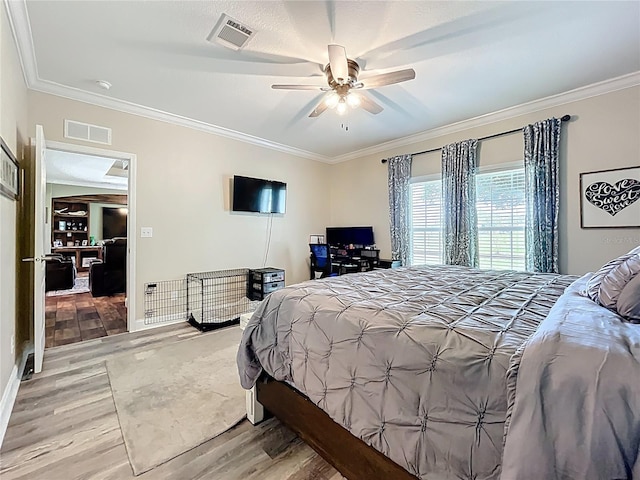 15311 Johns Lake Rd, Clermont, FL 34711 - bedroom featuring light wood-type flooring, crown molding, ceiling fan, and baseboards