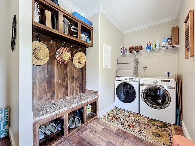 15311 Johns Lake Rd, Clermont, FL 34711 - laundry area with crown molding, baseboards, separate washer and dryer, and wood finished floors