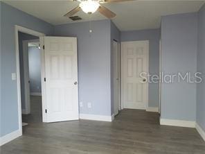 5144 Picadilly Circus Ct Unit 2, Orlando, FL 32839 - unfurnished bedroom with baseboards, wood finished floors, and a ceiling fan