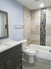 5144 Picadilly Circus Ct Unit 2, Orlando, FL 32839 - bathroom featuring vanity, shower / bath combo with shower curtain, toilet, and recessed lighting