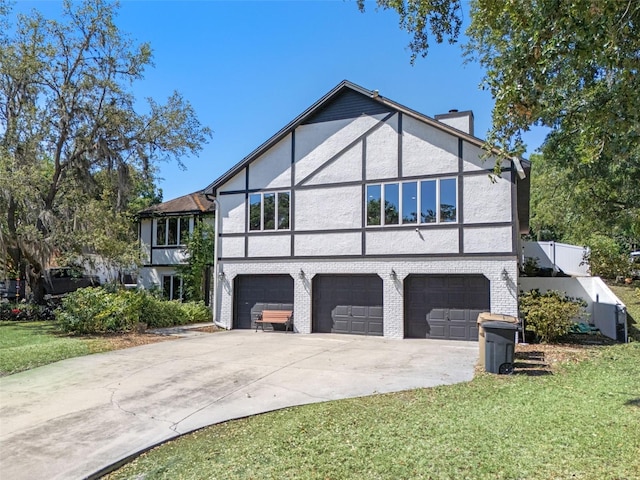 11951 Elbert St, Clermont, FL 34711 - view of front facade with a chimney, an attached garage, concrete driveway, stucco siding, and a front yard