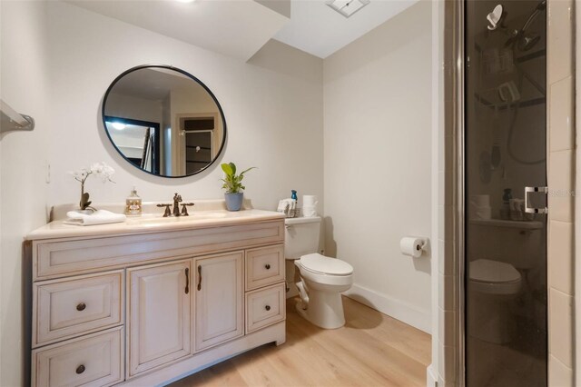 11951 Elbert St, Clermont, FL 34711 - bathroom featuring wood finished floors, vanity, and a shower stall