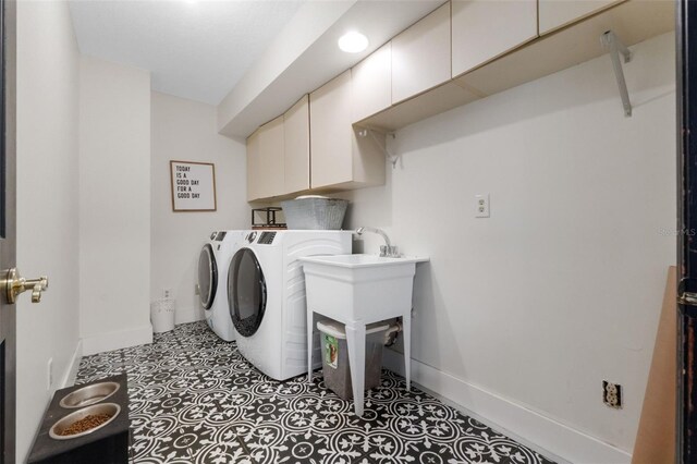 11951 Elbert St, Clermont, FL 34711 - laundry area with cabinet space, independent washer and dryer, and tile patterned floors