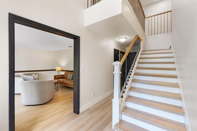 11951 Elbert St, Clermont, FL 34711 - stairway featuring wood finished floors and baseboards
