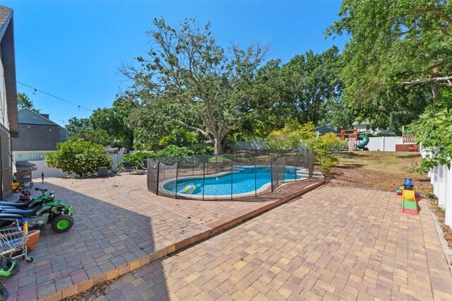 11951 Elbert St, Clermont, FL 34711 - view of swimming pool featuring a patio and a fenced backyard