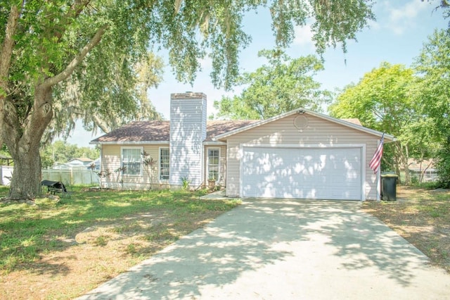 7410 Orange Crest Cir, Lakeland, FL 33810 - ranch-style house featuring concrete driveway, a chimney, and a garage