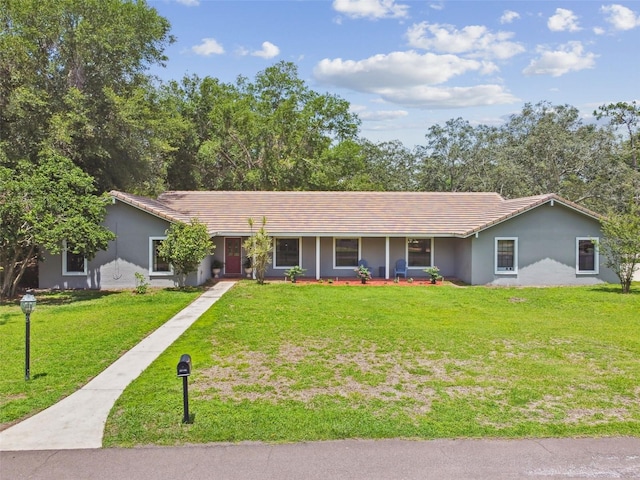 16 Pine Forest Dr, Haines City, FL 33844 - ranch-style home featuring a front yard, stucco siding, and covered porch