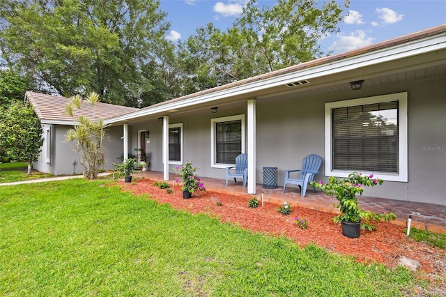16 Pine Forest Dr, Haines City, FL 33844 - view of front of house with a front yard and stucco siding