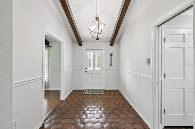 16 Pine Forest Dr, Haines City, FL 33844 - foyer entrance with a chandelier and beamed ceiling