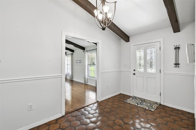 16 Pine Forest Dr, Haines City, FL 33844 - entrance foyer featuring a chandelier and baseboards