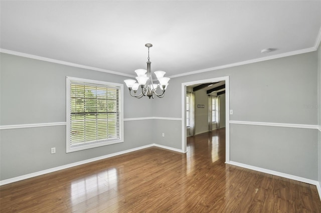 16 Pine Forest Dr, Haines City, FL 33844 - empty room with a chandelier, ornamental molding, and wood finished floors