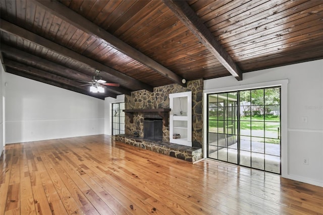 16 Pine Forest Dr, Haines City, FL 33844 - unfurnished living room featuring hardwood / wood-style flooring, wooden ceiling, a fireplace, and a ceiling fan