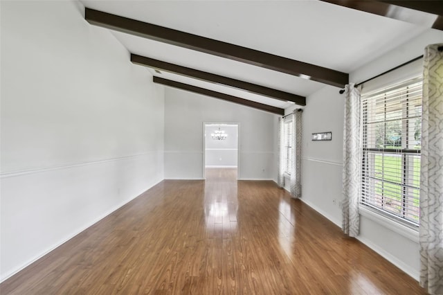 16 Pine Forest Dr, Haines City, FL 33844 - spare room with plenty of natural light, a chandelier, and wood finished floors