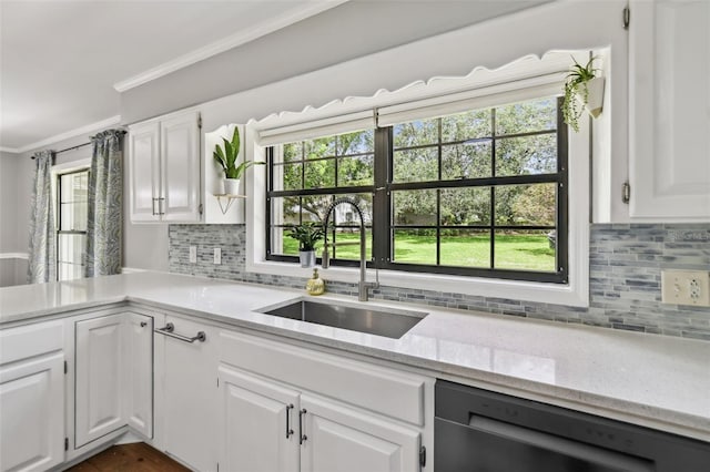 16 Pine Forest Dr, Haines City, FL 33844 - kitchen featuring dishwasher, ornamental molding, light stone countertops, backsplash, and healthy amount of natural light