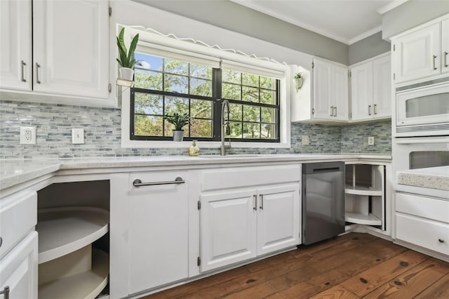 16 Pine Forest Dr, Haines City, FL 33844 - kitchen with white appliances, ornamental molding, white cabinetry, tasteful backsplash, and dark wood-style flooring