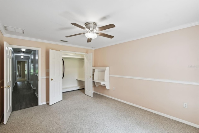 16 Pine Forest Dr, Haines City, FL 33844 - unfurnished bedroom with carpet, ornamental molding, a closet, and a ceiling fan